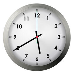 Close-up of clock over white background