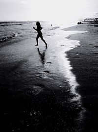 People jumping on beach