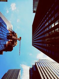 Low angle view of skyscrapers against sky