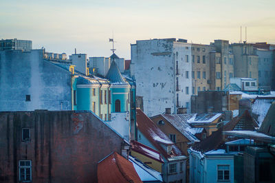 High angle view of buildings in city against sky