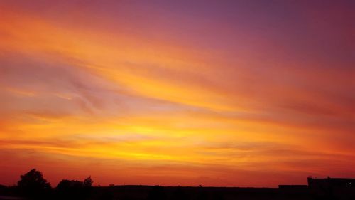 Scenic view of dramatic sky during sunset