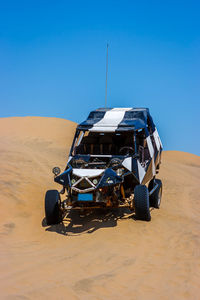 View of desert against clear sky