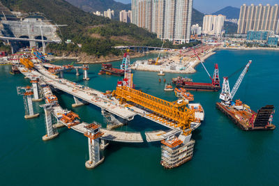 High angle view of cranes at harbor