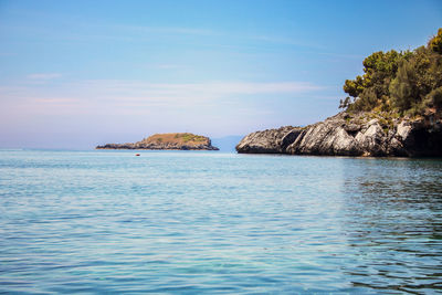 Scenic view of sea against blue sky