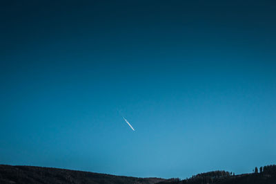 Low angle view of vapor trails in sky