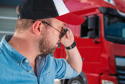 Side view of man using mobile phone