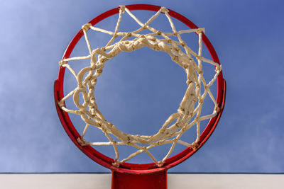 Low angle view of basketball hoop against sky