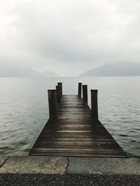 Pier over sea against sky