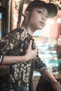 Close-up portrait of young woman standing outdoors