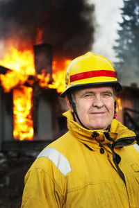 Fire fighter in front of burning buildings