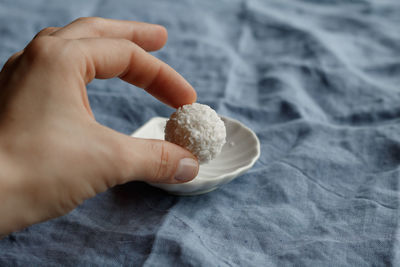 Close-up of person holding food