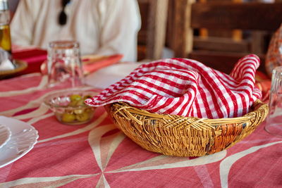 Table served for a dinner with basket for bread