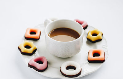 Close-up of coffee cup over white background