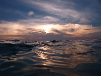 Scenic view of sea against sky at sunset