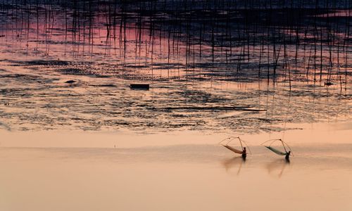 Scenic view of sea at sunset