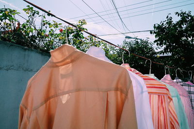 Clothes drying on clothesline against trees