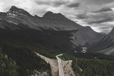 Scenic view of mountains against cloudy sky