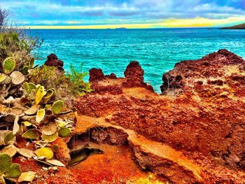 Scenic view of sea against cloudy sky