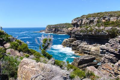 Scenic view of sea against clear blue sky