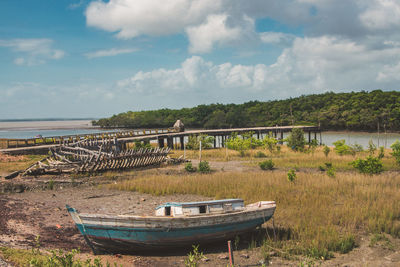 Abandoned boat on shore