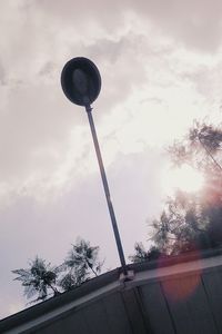 Low angle view of communications tower against sky