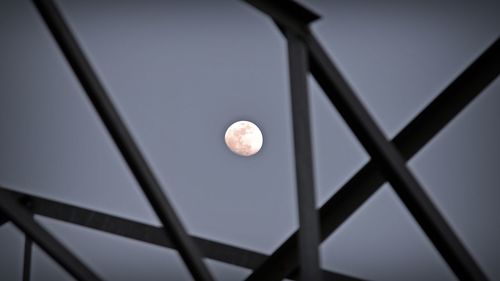 Low angle view of ball against moon at night