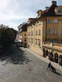 Buildings in town against sky