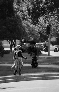 Woman with dog statue on tree