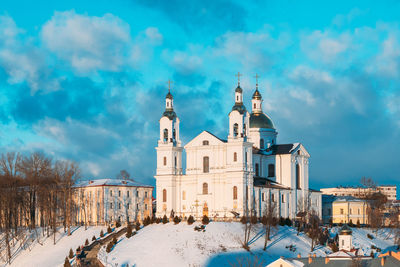 View of buildings in city against sky