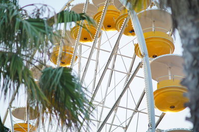 Low angle view of yellow toy hanging on plant