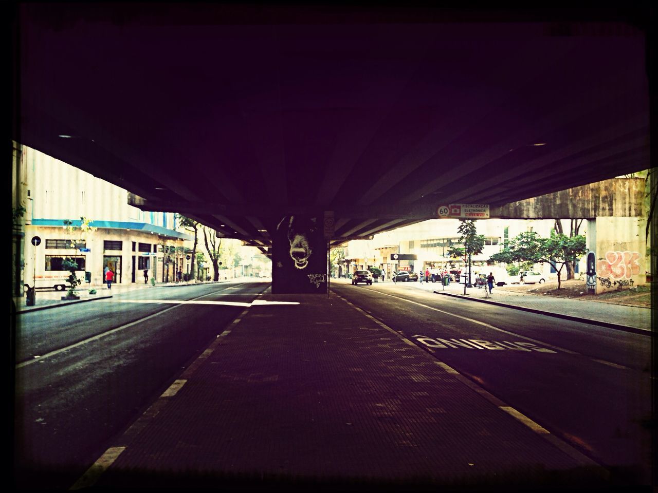 transportation, architecture, built structure, railroad station platform, the way forward, mode of transport, railroad track, road, public transportation, railroad station, road marking, car, city, land vehicle, rail transportation, diminishing perspective, transfer print, indoors, empty, street