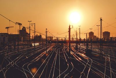 High angle view of railroad tracks against sky during sunset