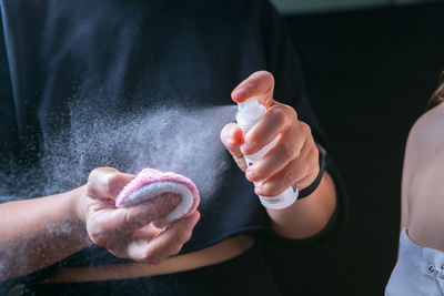 Midsection of woman holding ice cream