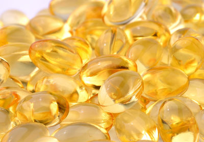 Cod liver oil capsules against white background