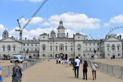 Group of people in front of historic building