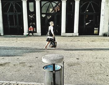 Woman standing in city