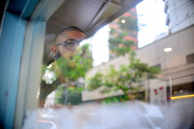 Man looking through cafe window