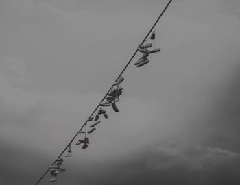 Low angle view of cables against sky