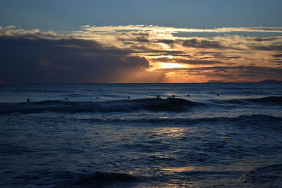 Scenic view of calm sea at sunset