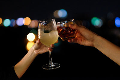 Close-up of hand holding wineglass