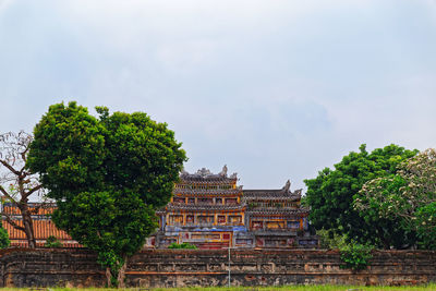 Colorful building in purple forbidden city, imperial citadel in hue