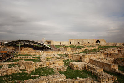 Old ruin building against cloudy sky