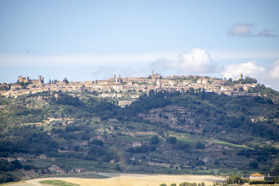 Buildings in city against sky