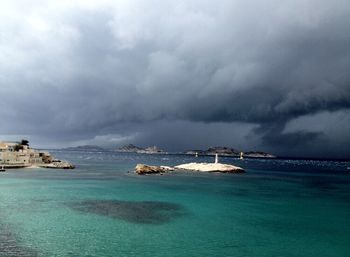 Scenic view of sea against cloudy sky