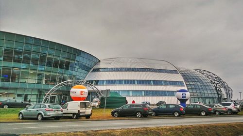 Cars on road against sky