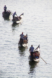 People on boat sailing in lake