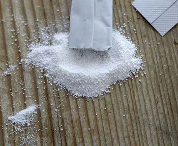 High angle view of magnesium powder on wooden table