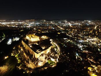 High angle view of illuminated buildings in city at night