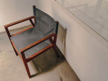 High angle view of empty chair on table at home