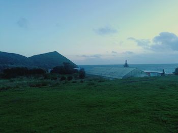 Scenic view of field against sky during sunset